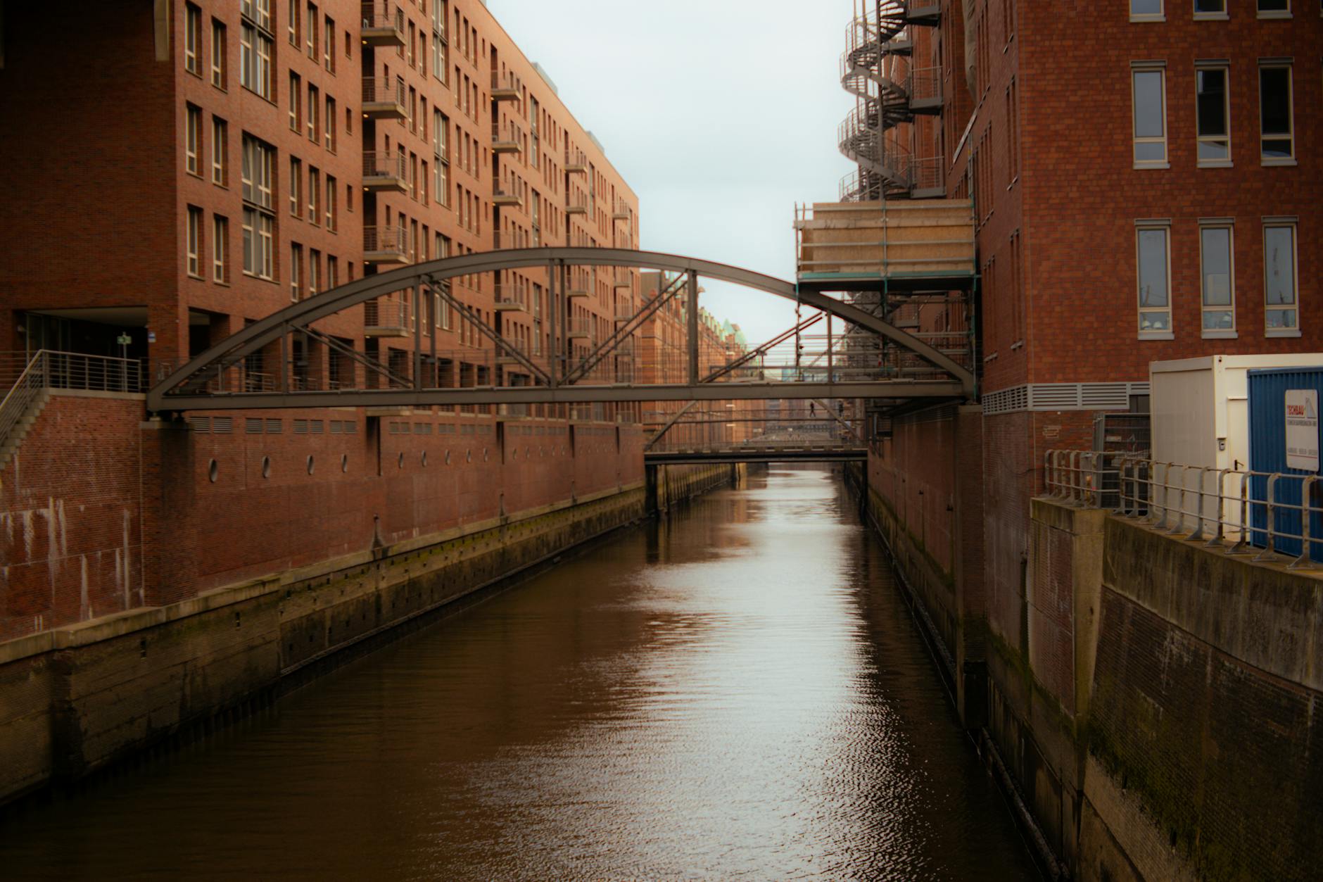 Explore the historic architecture and tranquil canal in Hamburg's renowned Speicherstadt district.